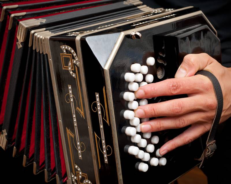 Playing the bandoneon, traditional tango instrument, Argentina