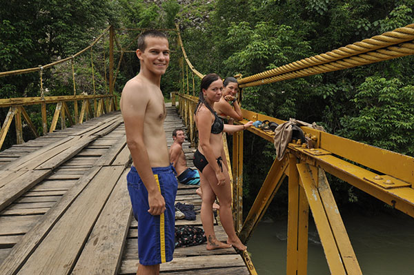 Jumping off the bridge near the Semuc Champey caves in Guatemala