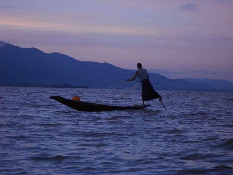 Fisherman at Inle Lake at sunrise